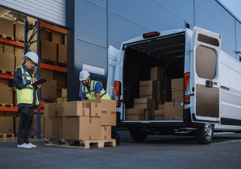 2 employees handling package logistics