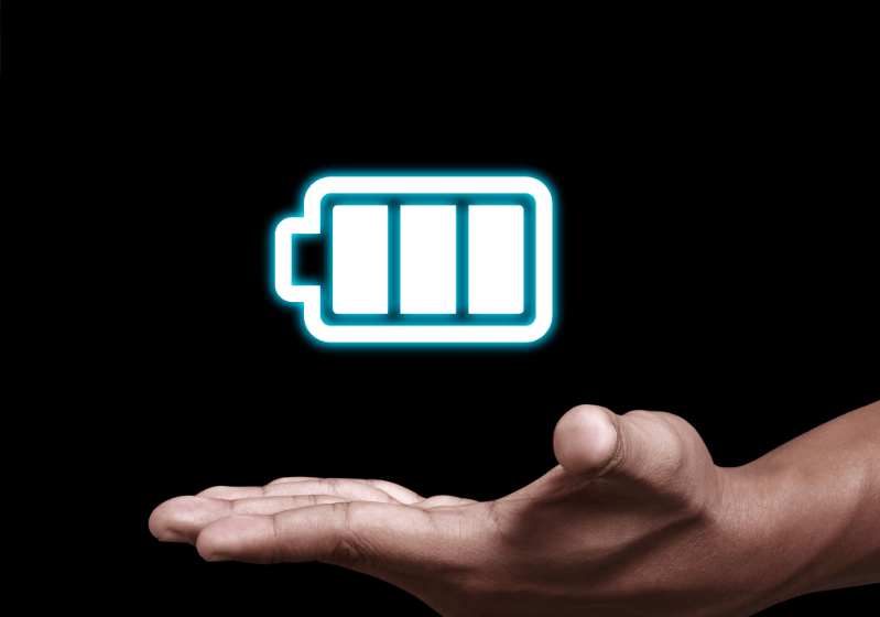 A hand with a floating Battery icon