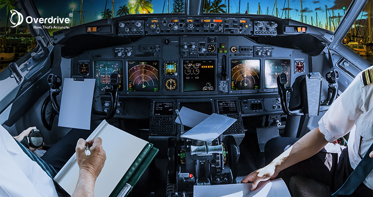 Pilots filling out paperwork in a cockpit